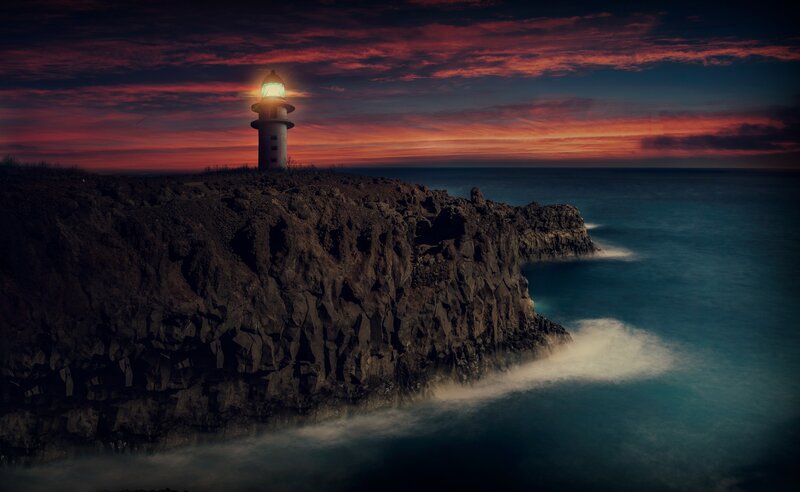 Lighthouse on Rocky Cliff — Red, Dramatic