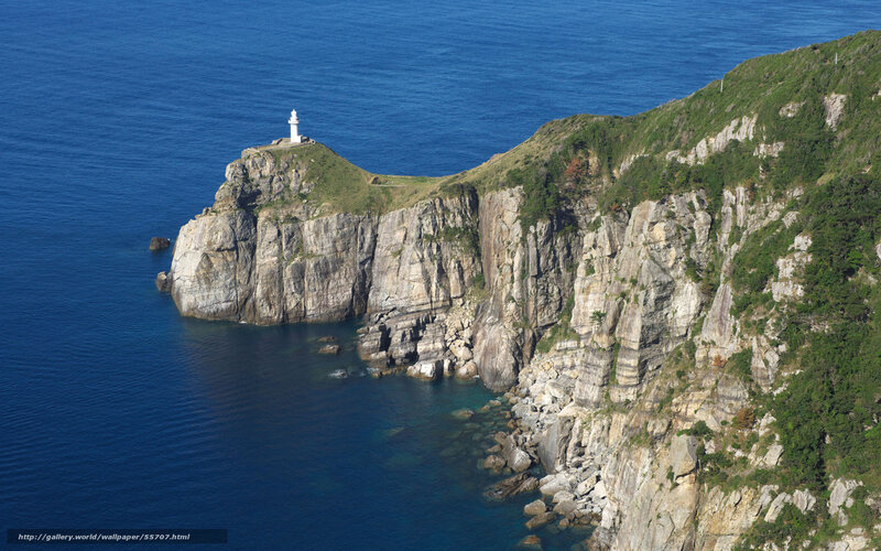 lighthouse on rocky cliff