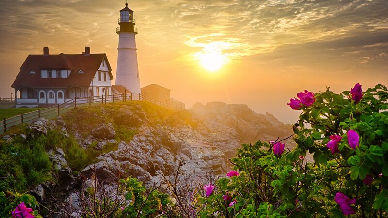 Lighthouse on Rocky Cliff — Yellow, Serene, Sunset, Photograph