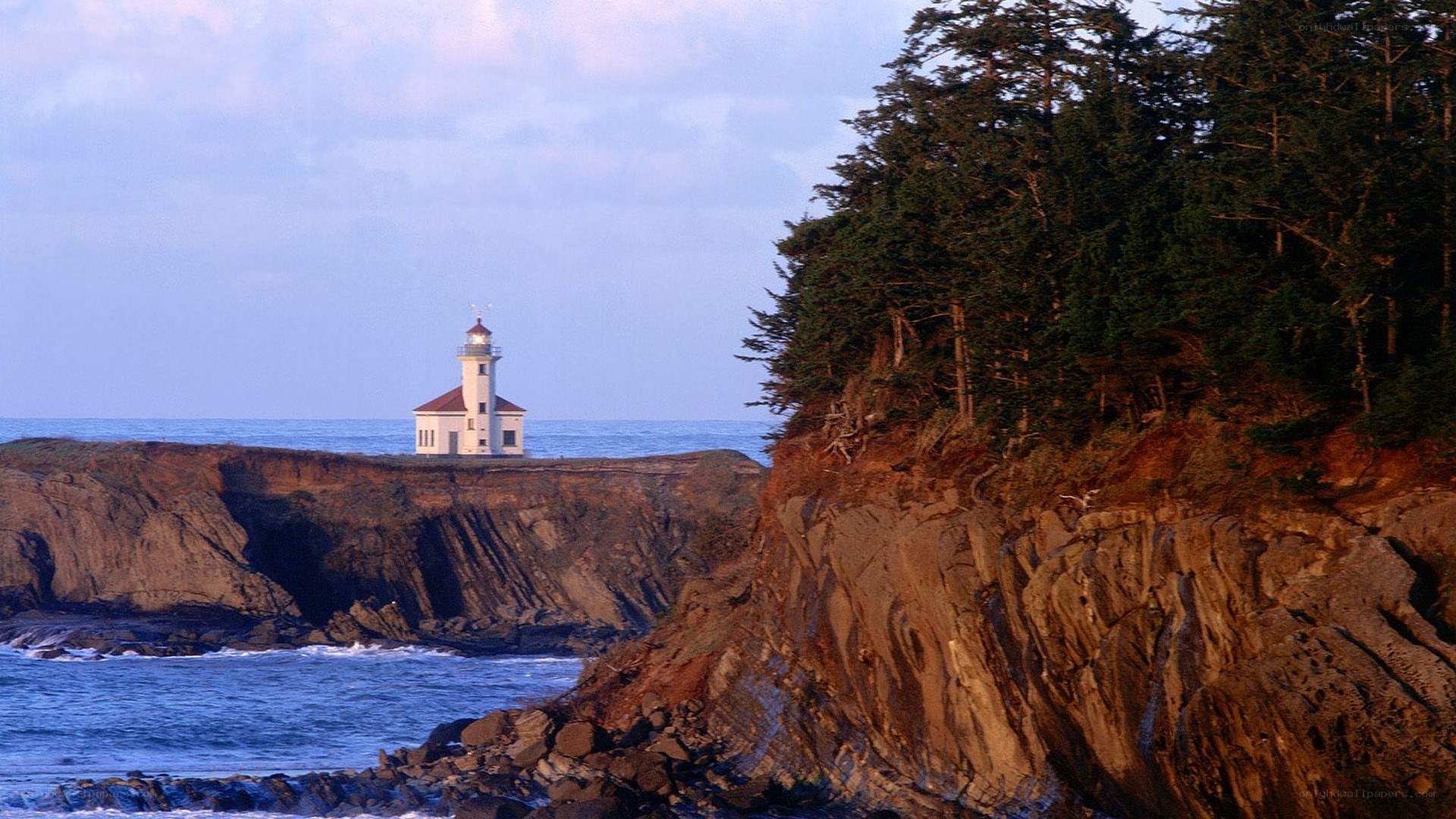 lighthouse on rocky coast