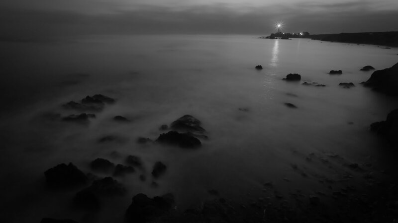Lighthouse on Rocky Coast — Black