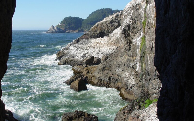 Lighthouse on Rocky Coast — Blue, Dramatic, Afternoon, Photograph, Ocean, Cliffs