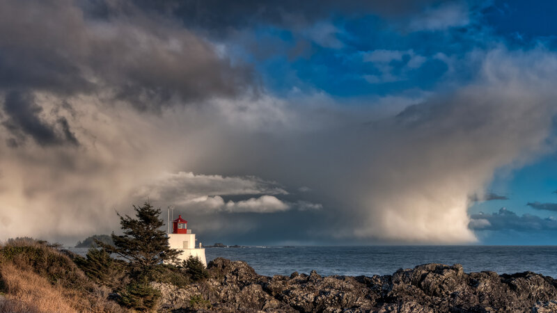 Lighthouse on Rocky Coast — Blue, Dramatic, Afternoon, Photograph, Ocean, Clouds