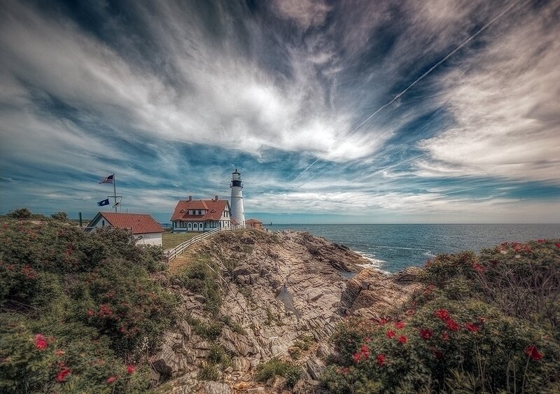 Lighthouse on Rocky Coast — Blue, Dramatic, Afternoon, Photograph, Ocean