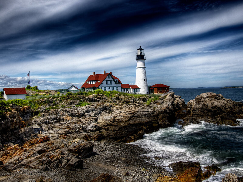 Lighthouse on Rocky Coast — Blue, Dramatic, Afternoon, Photograph, Rocks