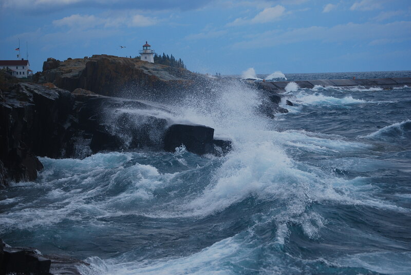 Lighthouse on Rocky Coast — Blue, Dramatic, Afternoon, Photograph