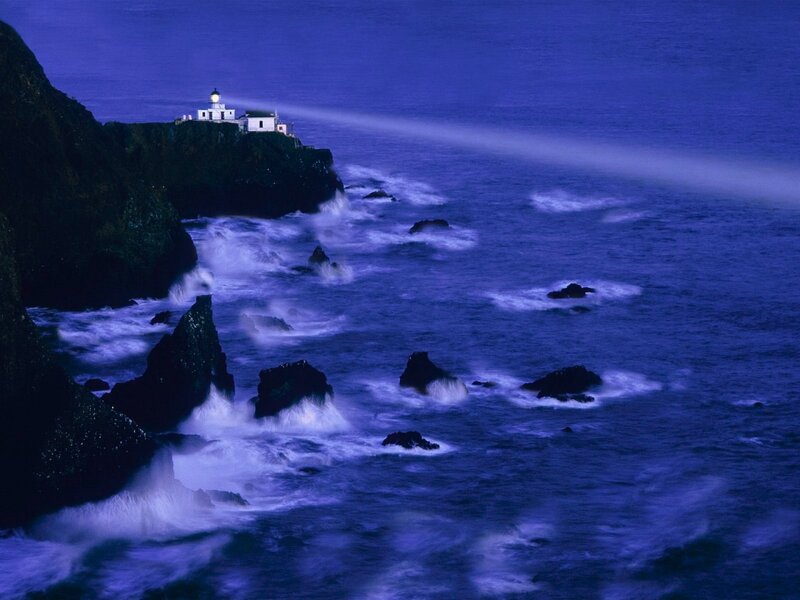 Lighthouse on Rocky Coast — Blue, Dramatic, Night, Photograph, Ocean