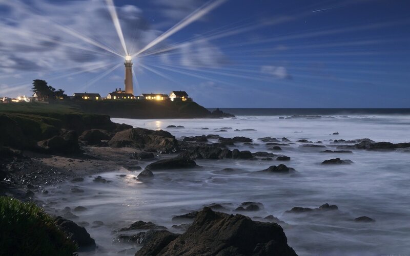 Lighthouse on Rocky Coast — Blue, Dramatic, Night, Photograph, Rocks