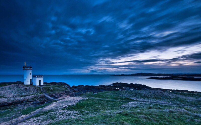Lighthouse on Rocky Coast — Blue, Dramatic, Night, Photograph, Sea