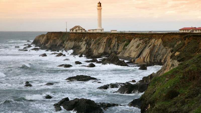 Lighthouse on Rocky Coast — Blue, Dramatic, Sunset, Photograph, Ocean, Cliffs, Buildings