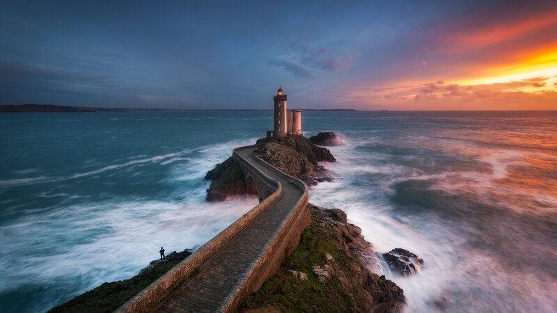 Lighthouse on Rocky Coast — Blue, Dramatic, Sunset, Photograph, Ocean, Sky, Path