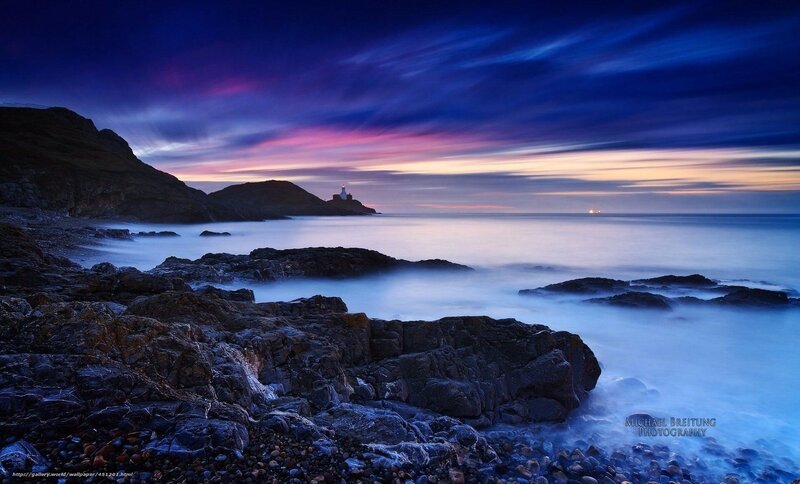 Lighthouse on Rocky Coast — Blue, Dramatic, Sunset, Photograph, Rocks, Sea