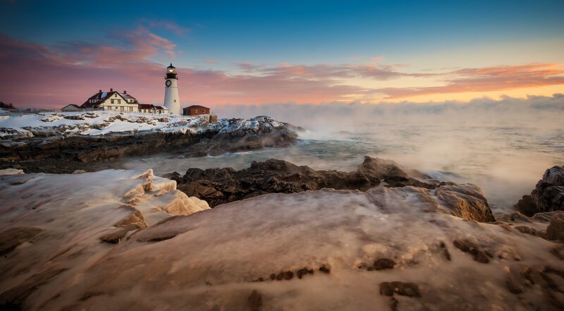 Lighthouse on Rocky Coast — Blue, Dramatic, Winter, Photograph, Snow
