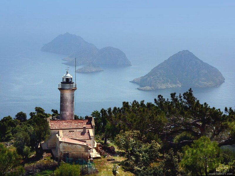 Lighthouse on Rocky Coast — Blue, Serene, Afternoon, Photograph, Islands