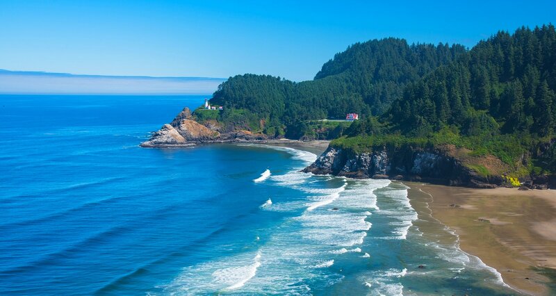 Lighthouse on Rocky Coast — Blue, Serene, Afternoon, Photograph, Ocean, Beach