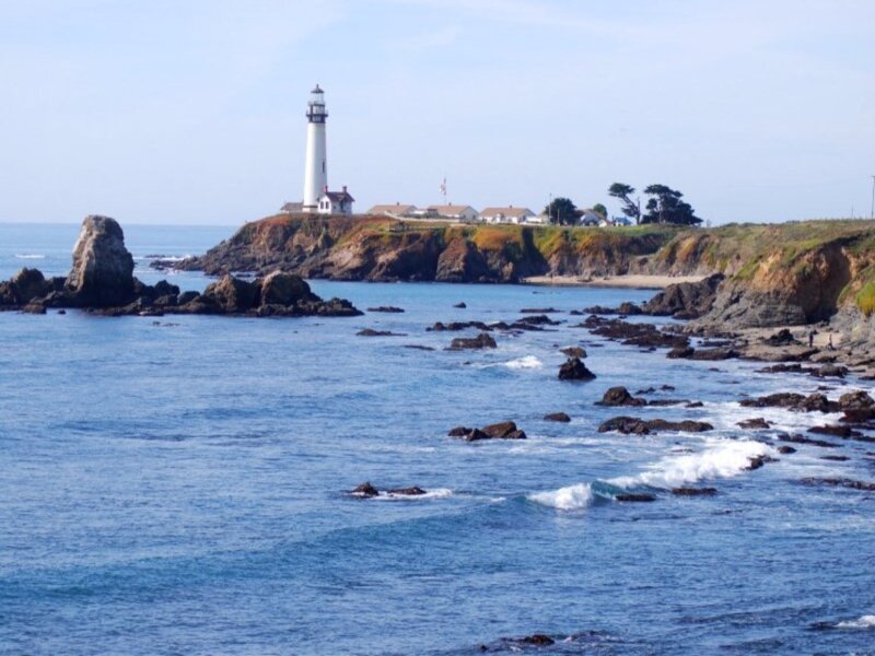 Lighthouse on Rocky Coast — Blue, Serene, Afternoon, Photograph, Ocean, Rocks, Cliffs