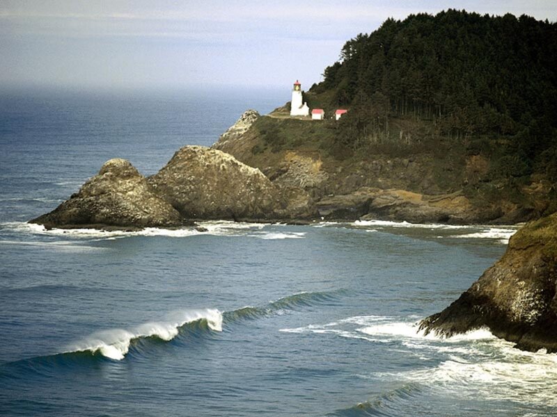 Lighthouse on Rocky Coast — Blue, Serene, Afternoon, Photograph, Ocean, Rocks, Forest