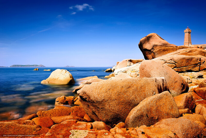 Lighthouse on Rocky Coast — Blue, Serene, Afternoon, Photograph, Rocks, Sea