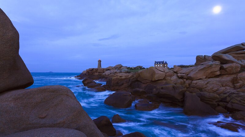 Lighthouse on Rocky Coast — Blue, Serene, Night, Photograph, Moon, Ocean