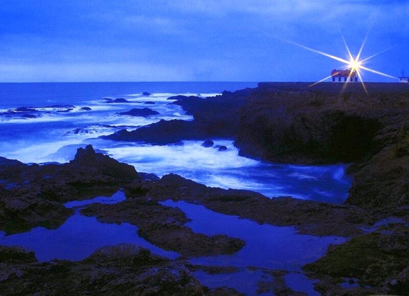 Lighthouse on Rocky Coast — Blue, Serene, Night