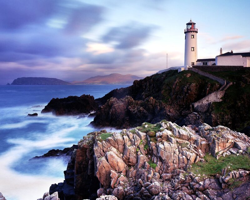 Lighthouse on Rocky Coast — Blue, Serene, Sunset, Photograph, Ocean, Cliffs