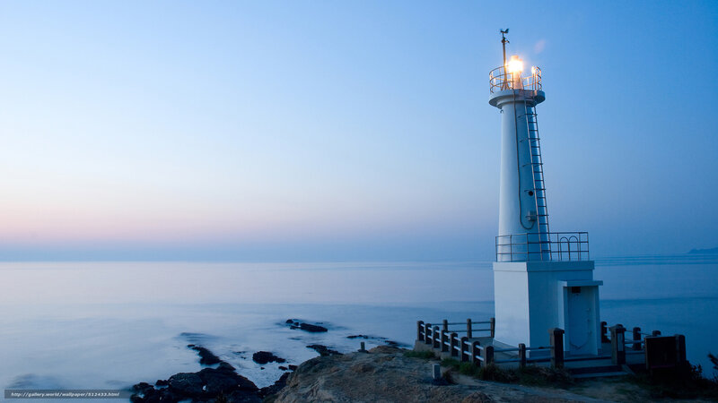Lighthouse on Rocky Coast — Blue, Serene, Sunset, Photograph, Ocean, Sky, Rocks