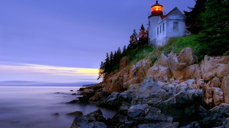 Lighthouse on Rocky Coast — Blue, Serene, Sunset, Photograph, Sea