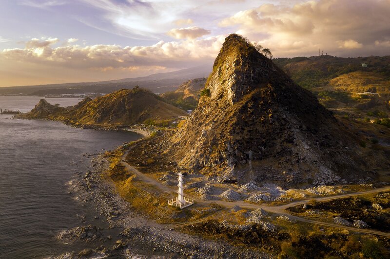 Lighthouse on Rocky Coast — Brown, Dramatic, Sunset