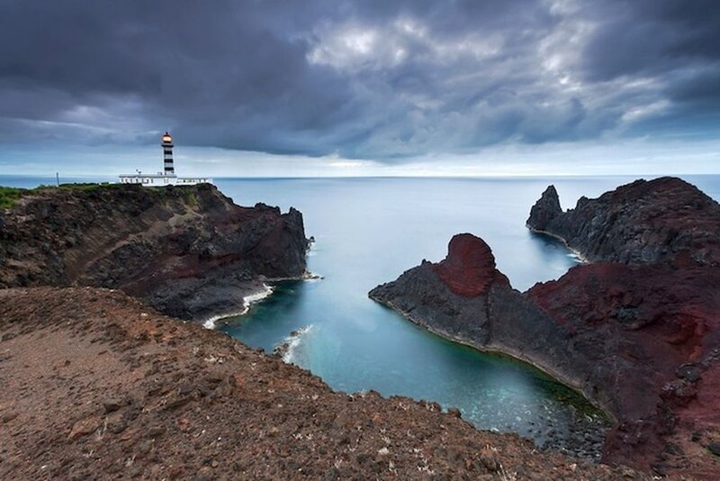 Lighthouse on Rocky Coast — Gray, Dramatic, Afternoon
