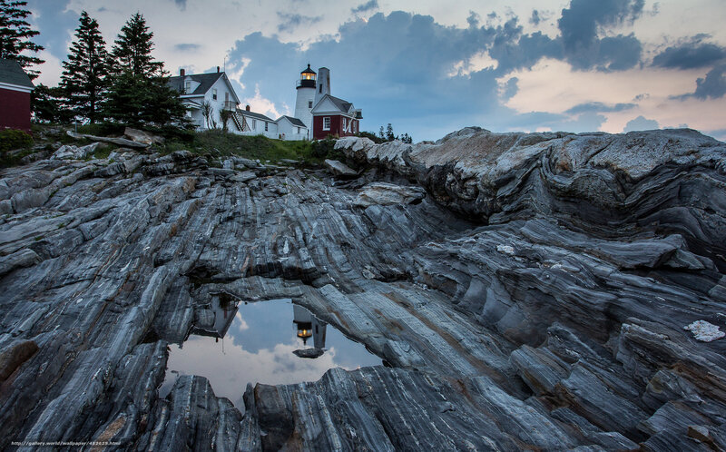 Lighthouse on Rocky Coast — Gray, Dramatic, Sunset, Photograph, Rocks