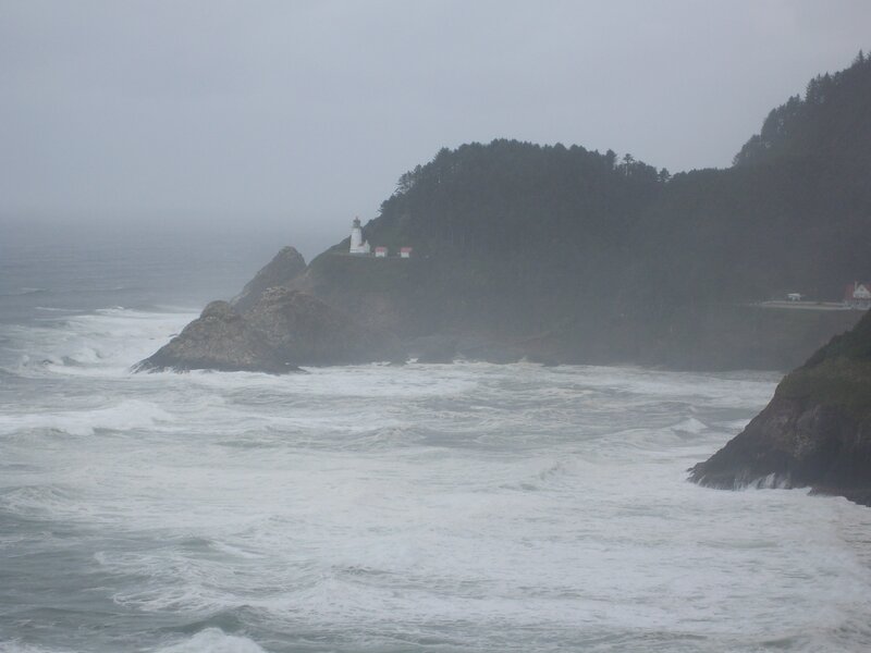 Lighthouse on Rocky Coast — Gray, Stormy