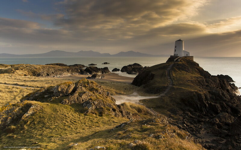 Lighthouse on Rocky Coast — Green, Dramatic, Sunset, Photograph