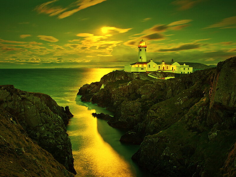 Lighthouse on Rocky Coast — Green, Dramatic