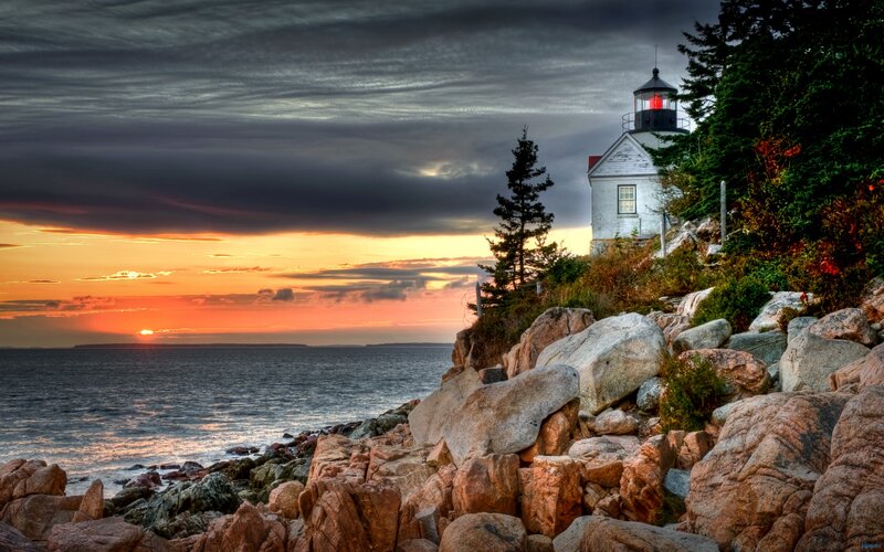 Lighthouse on Rocky Coast — Orange, Dramatic, Sunset, Photograph, Ocean, Trees, Sky