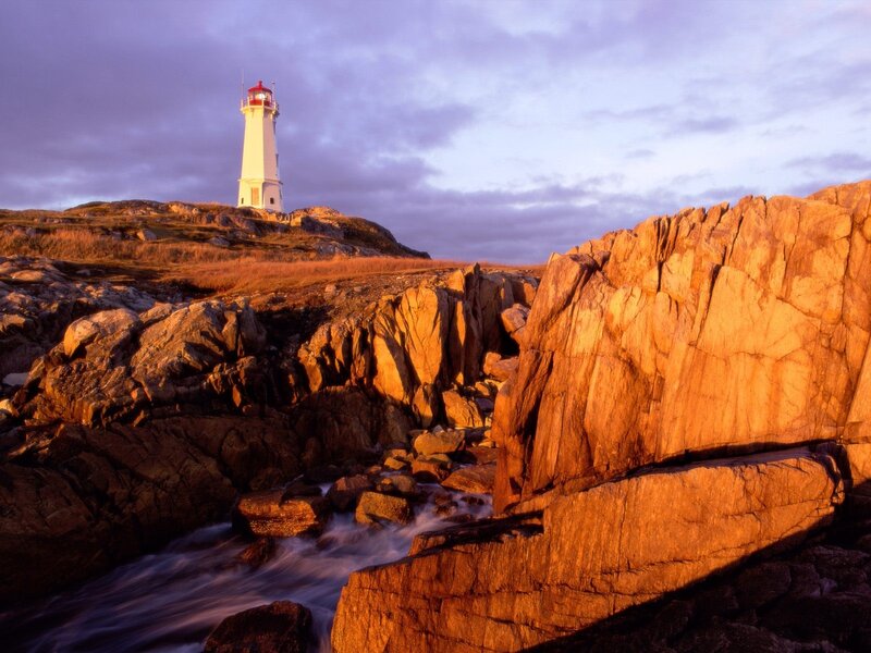 Lighthouse on Rocky Coast — Orange, Dramatic, Sunset, Photograph, Rocks, Sea, Sky, Purple
