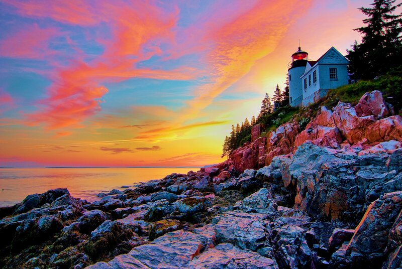 Lighthouse on Rocky Coast — Orange, Dramatic, Sunset, Photograph, Rocks, Sea