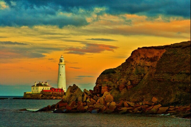 Lighthouse on Rocky Coast — Orange, Dramatic, Sunset