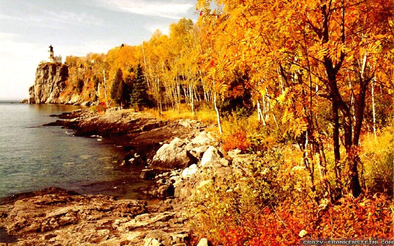 Lighthouse on Rocky Coast — Orange, Serene, Autumn