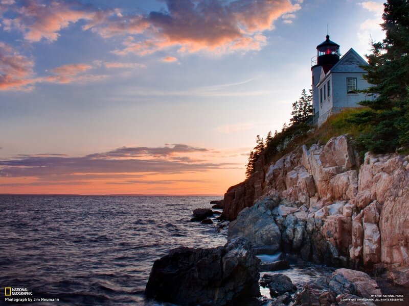 Lighthouse on Rocky Coast — Orange, Serene, Sunset, Photograph, Ocean, Sky, Trees