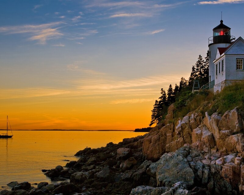 Lighthouse on Rocky Coast — Orange, Serene, Sunset