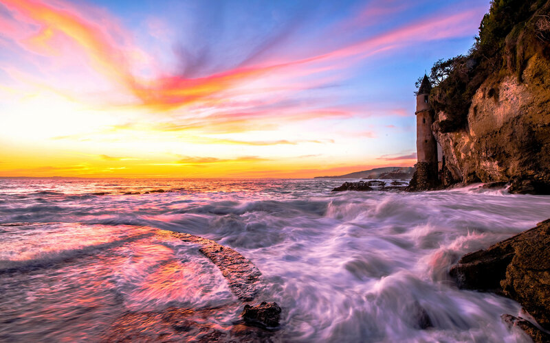 Lighthouse on Rocky Coast — Pink, Dramatic, Sunset, Photograph