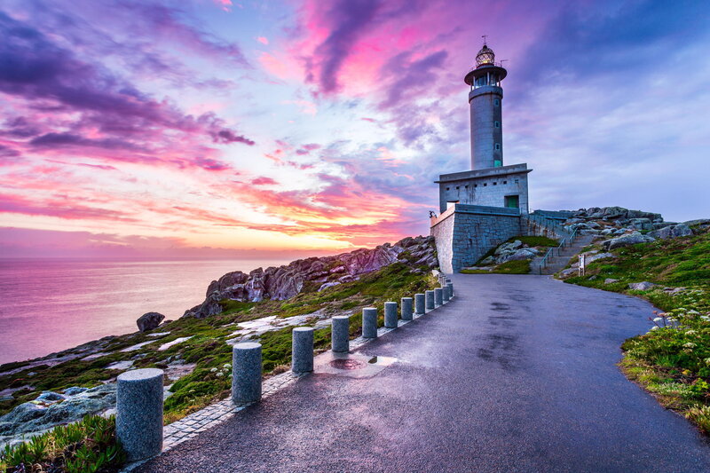 Lighthouse on Rocky Coast — Purple, Dramatic, Sunset, Photograph, Ocean, Sky