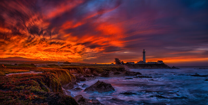 Lighthouse on Rocky Coast — Red, Dramatic