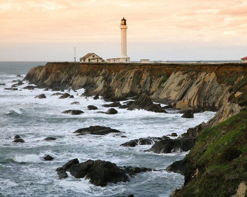 Lighthouse on Rocky Coast — White, Dramatic