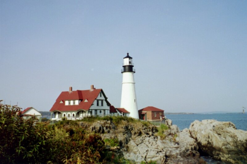 Lighthouse on Rocky Coast — White, Serene