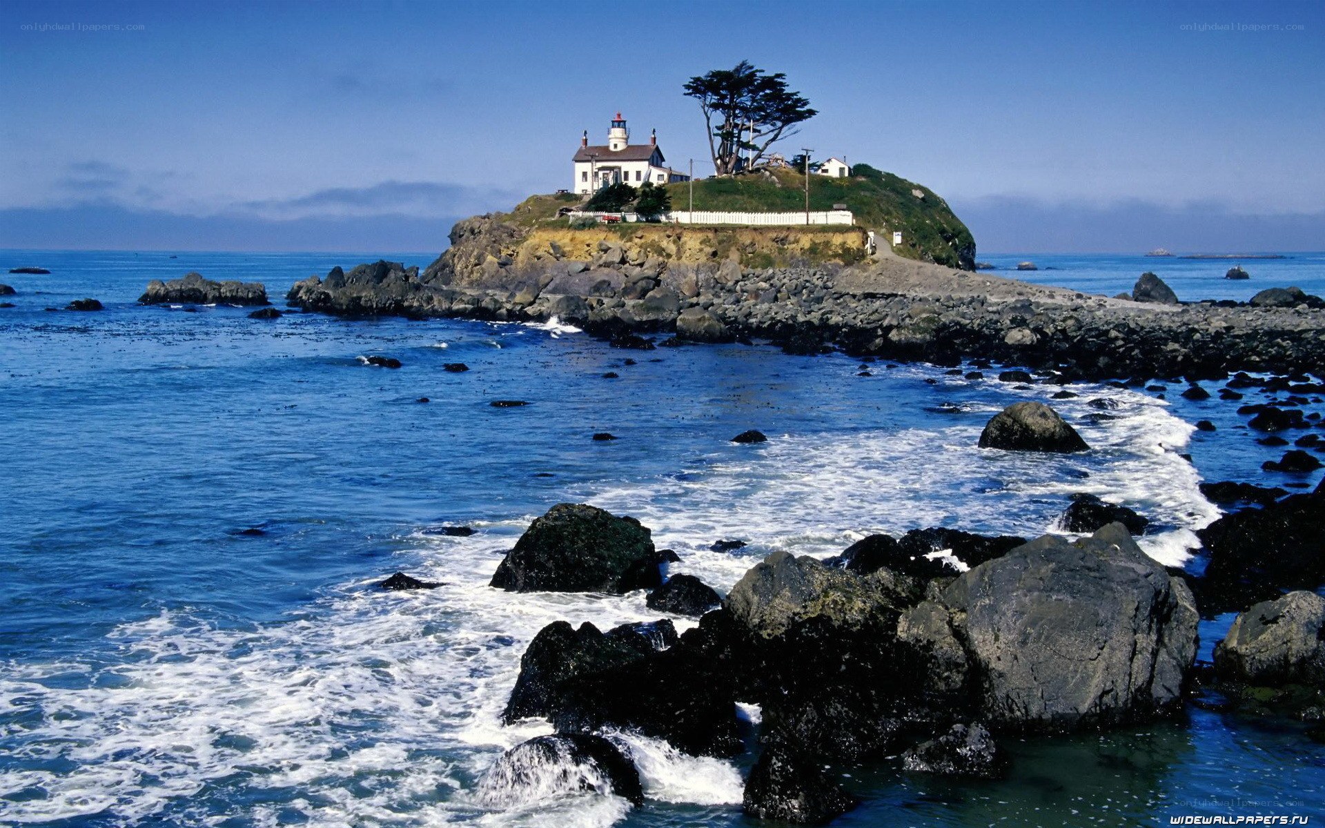 lighthouse on rocky island