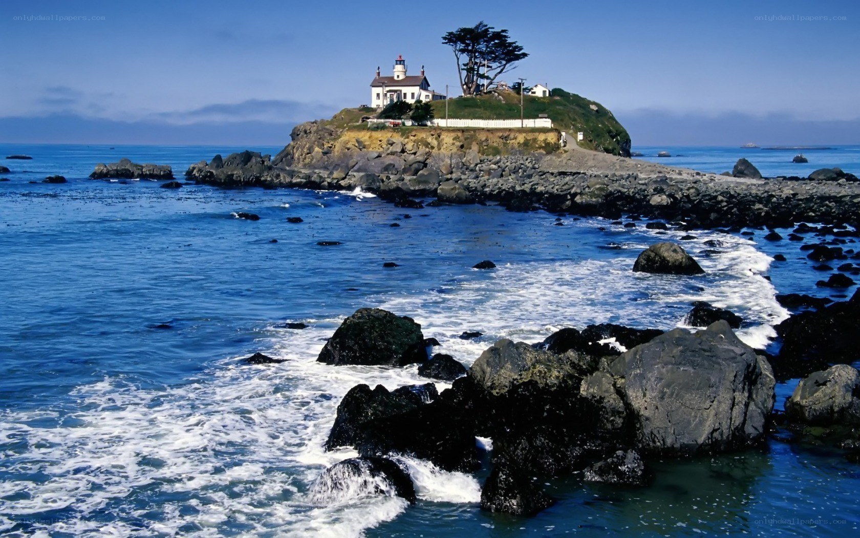 lighthouse on rocky island