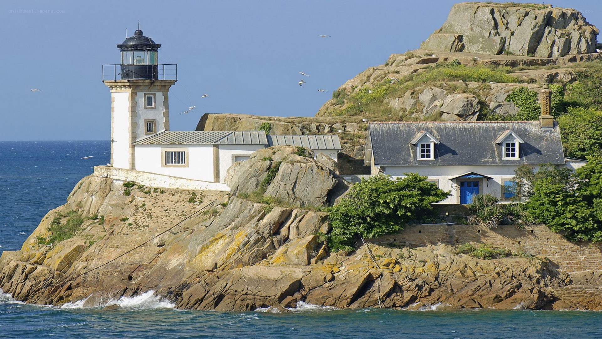 lighthouse on rocky island