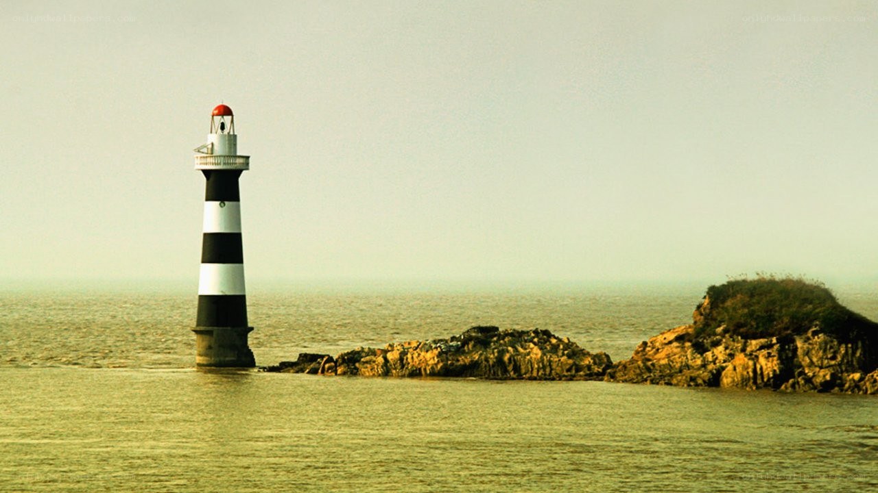 lighthouse on rocky island