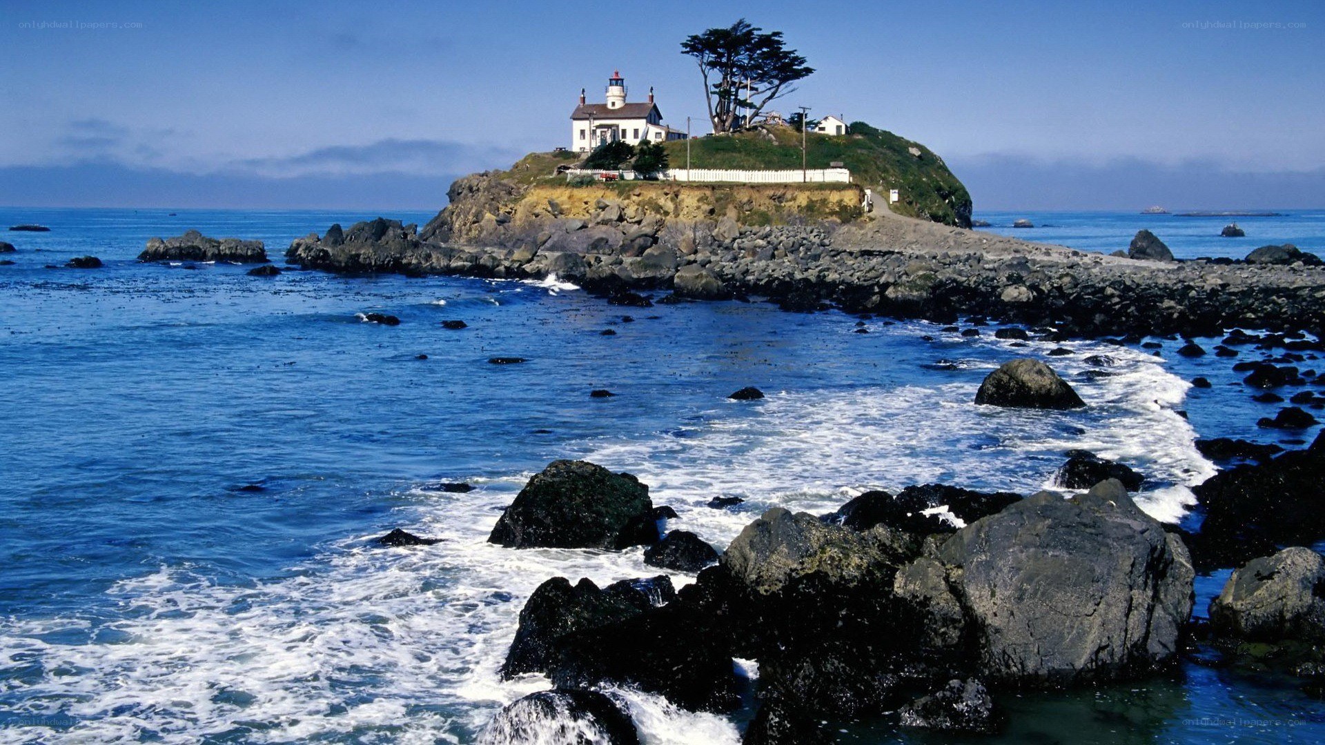 lighthouse on rocky island